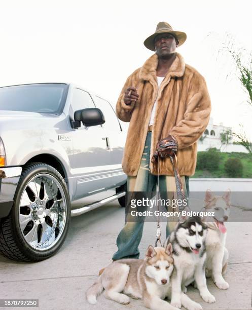 American singer and actor Tyrese with his dogs in March 2004 in Temecula, California.