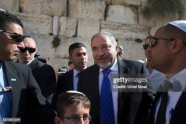 Former Israeli Foreign Minister, Avigdor Lieberman is surrounded by supporters and security as he visits the Western wall after the verdict on...