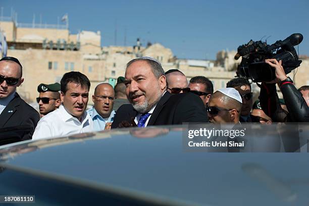 Former Israeli Foreign Minister, Avigdor Lieberman is surrounded by supporters and security as he visits the Western wall after the verdict on...