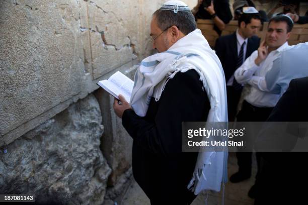 Former Israeli Foreign Minister Avigdor Lieberman prays at the Western wall after the verdict on charges of fraud and breach of trust was given on...