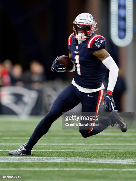 DeVante Parker of the New England Patriots carries the ball during the game against the Kansas City Chiefs at Gillette Stadium on December 17, 2023...