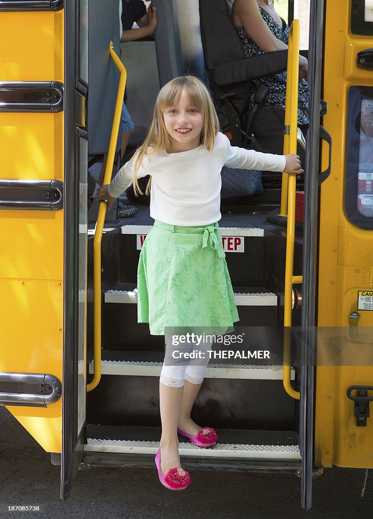 Girl getting off school bus