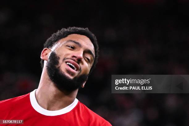 Liverpool's English defender Joe Gomez reacts after missing to score during the English Premier League football match between Liverpool and Arsenal...