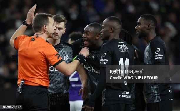 Referee Nathan Verboomen gestures during a soccer match between RSC Anderlecht and KRC Genk, on day 19 of the 2023-2024 'Jupiler Pro League' first...