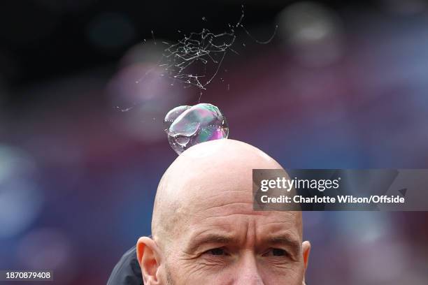 Bubble pops on the head of Manchester United manager Erik ten Hag during the Premier League match between West Ham United and Manchester United at...