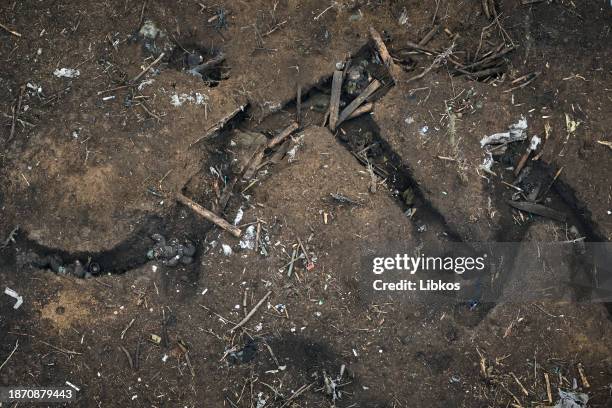 Bodies of Russian soldiers in a trench on the slopes of Avdivkaon December 23, 2023 in Avdiivka, Ukraine. Both Ukraine and Russia have recently...