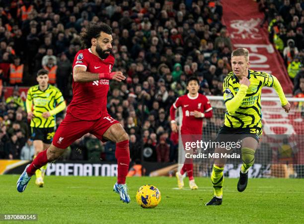 Mohamed Salah of Liverpool dribbles past Oleksandr Zinchenko of Arsenal during the Premier League match between Liverpool FC and Arsenal FC at...