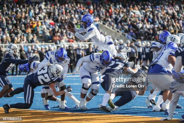 Quarterback Darren Grainger of the Georgia State Panthers soars into the endzone during the first half of the Famous Idaho Potato Bowl against the...