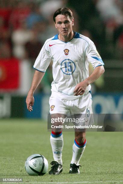 June 16: Dmitri Alenichev of Russia on the ball during the UEFA Euro 2004 match between Russia and Portugal at Luz Stadium on June 16, 2004 in...