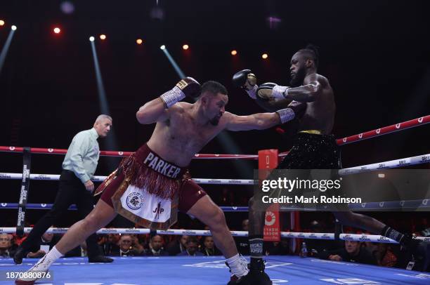 Joseph Parker lands a left jab to the body of Deontay Wilder during a heavyweight fight at the Day of Reckoning event at Kingdom Arena on December...