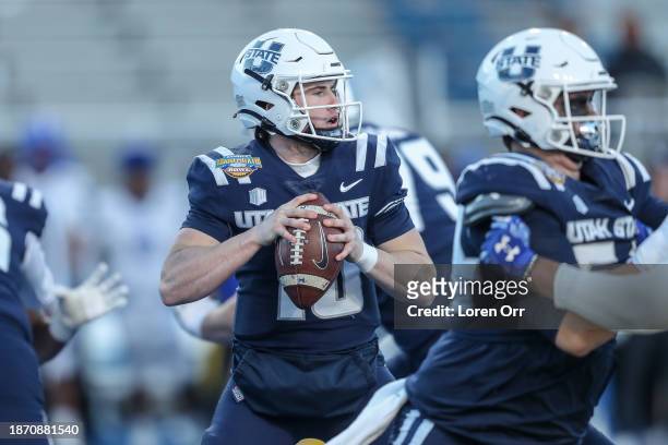 Quarterback McCae Hillstead of the Utah State Aggies prepares to pass the ball during the second half of the Famous Idaho Potato Bowl against the...
