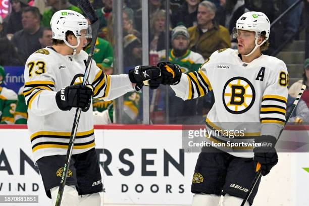 Boston Bruins Right Wing David Pastrnak celebrates his power play goal with Boston Bruins Defenceman Charlie McAvoy during the first period of an NHL...