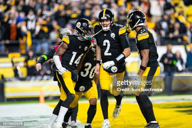 Pittsburgh Steelers quarterback Mason Rudolph celebrates with Pittsburgh Steelers wide receiver George Pickens after a touchdown during the regular...