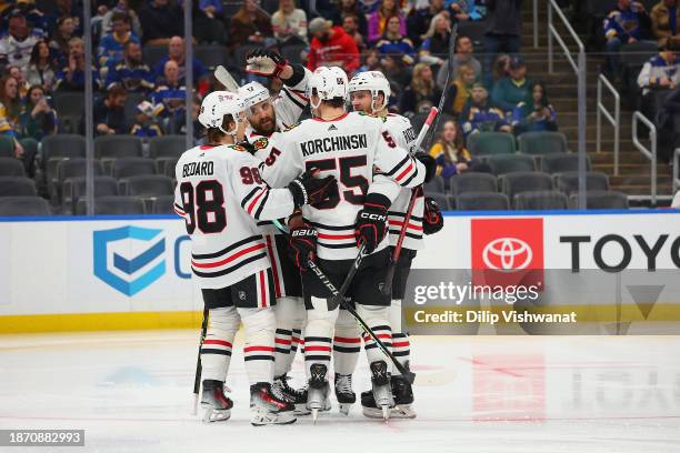 Members of the Chicago Blackhawks celebrate after scoring a goal against the St. Louis Blues in the second period at Enterprise Center on December...