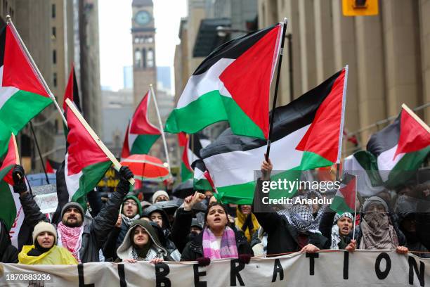 Pro-Palestinian demonstrators march during a rally in downtown Toronto, Ontario on December 23, 2023. Demonstrators gathered at Yonge and Dundas...