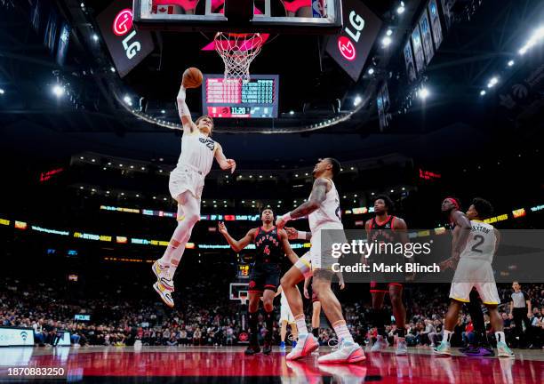 Lauri Markkanen of the Utah Jazz drunks against the Toronto Raptors during the second half of their basketball game at the Scotiabank Arena on...