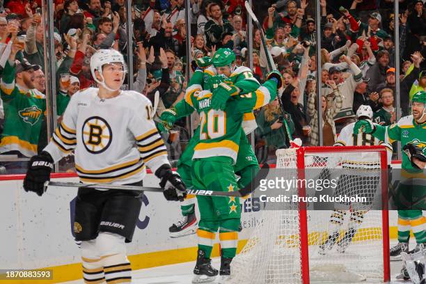 Marcus Foligno of the Minnesota Wild celebrates his goal with his teammate Vinni Lettieri against the Boston Bruins during the game at the Xcel...
