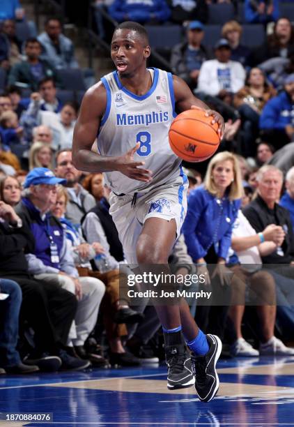 David Jones of the Memphis Tigers dribbles the ball against the Vanderbilt Commodores during the second half on December 23, 2023 at FedExForum in...