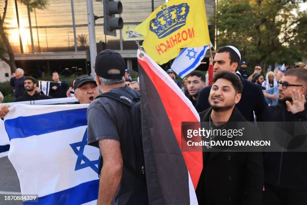 Israel counter protesters and pro-Palestinian protesters argue during the "Black & Palestinian Solidarity for a Ceasefire this Xmas" by the Beverly...