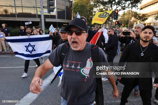 Israel counter protesters taunt pro-Palestinian protesters gathered during the "Black & Palestinian Solidarity for a Ceasefire this Xmas" by the...
