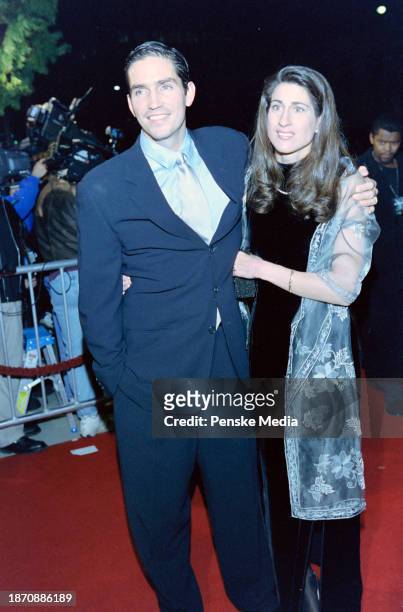 Jim Caviezel and Kerri Browitt Caviezel attend the local premiere of "The Thin Red Line" at the Academy Theater in Beverly Hills, California, on...