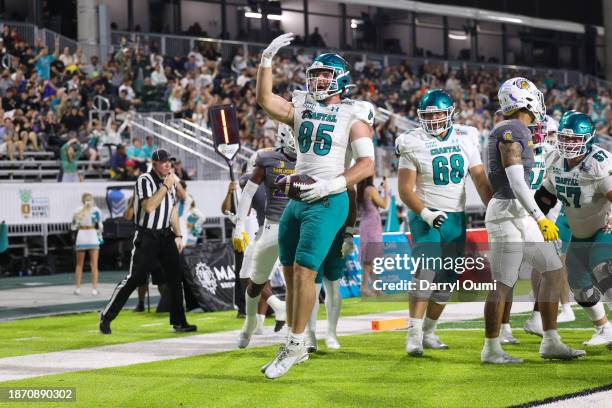 Kendall Karr of the Coastal Carolina Chanticleers gestures to the fans after scoring a touchdown during the first half of the Hawaii Bowl against the...