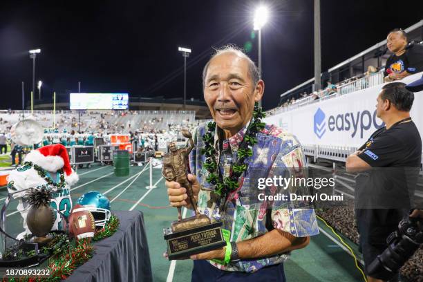 Hugh Yoshida poses with the Hugh Yoshida Most Valuable Player Trophy during the first half of the Hawaii Bowl at Clarence T.C. Ching Athletics...