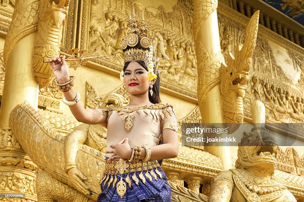 Apsara female dancer in golden temple