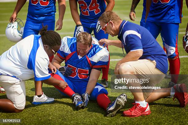 injured football player - buff headwear stock pictures, royalty-free photos & images