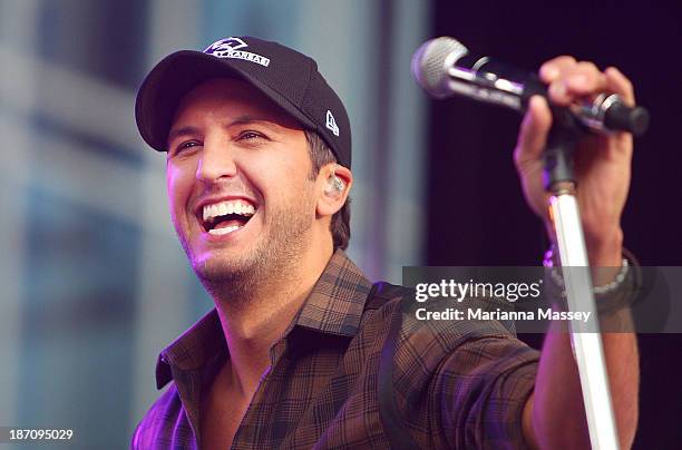 Luke Bryan performs on ABC's "Good Morning America" outside of the Bridgestone Arena ahead of the CMA Awards on November 6, 2013 in Nashville,...