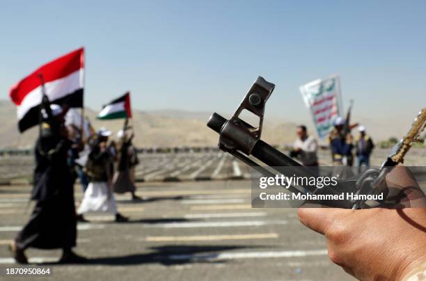 Amran, YEMEN A soldier guards as Yemen's Houthi loyalists take part in an armed parade for more than 20,000 members who have finished a military...