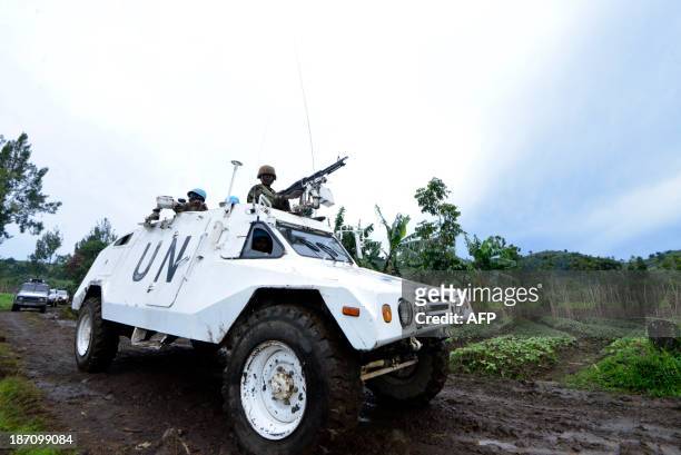 Mission in DR Congo armored personnel carrier patrols on November 5, 2013 on Chanzu hill, 80 kilometres north of regional capital Goma, in the...