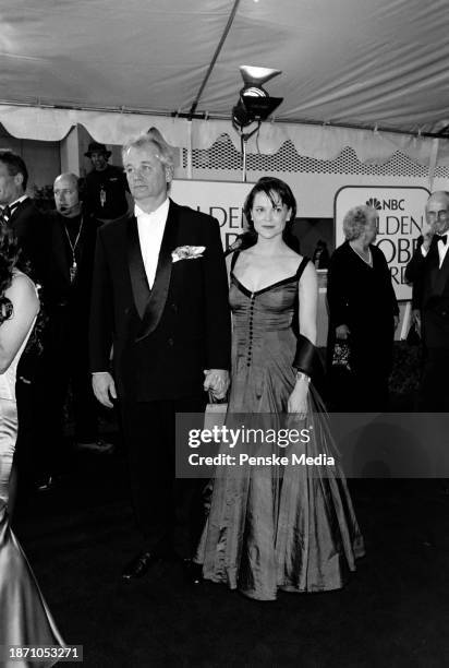 Bill Murray and Jennifer Butler attend the 56th Golden Globe Awards at the Beverly Hilton Hotel in Beverly Hills, California, on January 24, 1999.