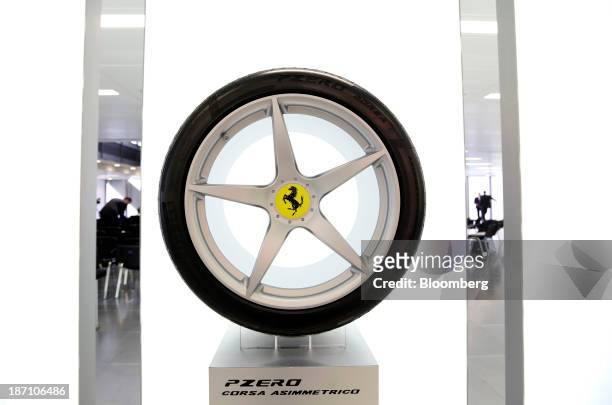 The Ferrari SpA badge is displayed on a wheel hub of a Pirelli P Zero tyre, manufactured by Pirelli SpA, following a news conference in London, U.K....