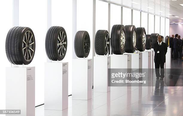 Automobile and truck Tires, manufactured by Pirelli SpA, sit on display following a news conference in London, U.K. On Wednesday, Nov. 6, 2013....