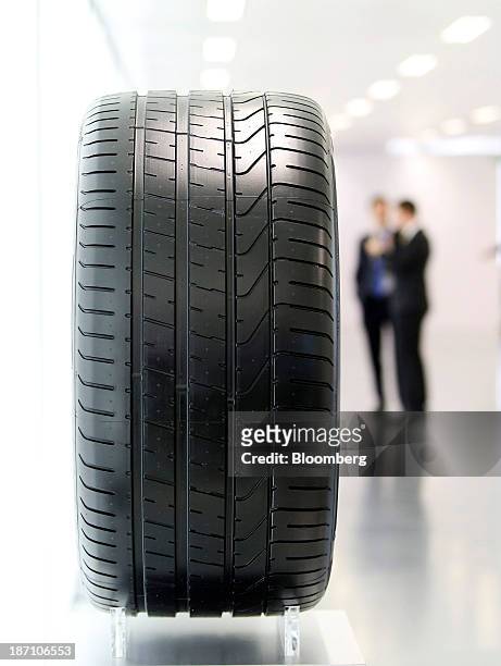 An automobile tire manufactured by Pirelli SpA sits on display following a news conference in London, U.K. On Wednesday, Nov. 6, 2013. Pirelli SpA,...