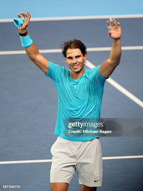 Rafael Nadal of Spain celebrates winning his men's singles match against Stanislas Wawrinka of Switzerland during day three of the Barclays ATP World...