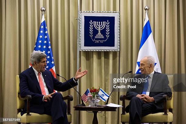 Secretary of State John Kerry meets with Israeli President Shimon Peres at the Israeli leader's residence November 6, 2013 in Jerusalem, Israel....