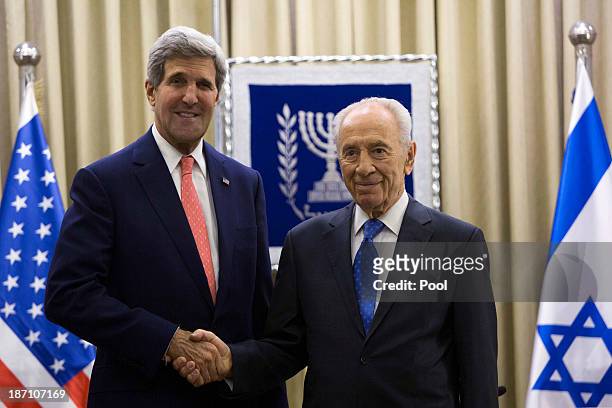 Secretary of State John Kerry meets with Israeli President Shimon Peres at the Israeli leader's residence November 6, 2013 in Jerusalem, Israel....