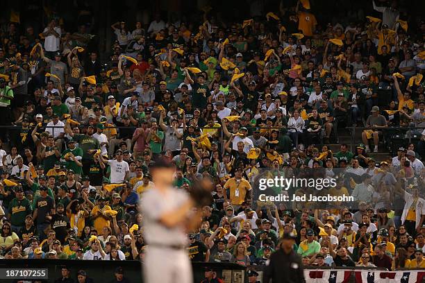 Fans cheer for the Oakland Athletics during Game One of the American League Division Series against the Detroit Tigers on Friday, October 4, 2013 at...
