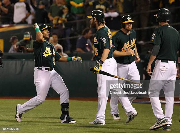 Yoenis Cespedes of the Oakland Athletics celebrates after a two run home run during Game One of the American League Division Series against the...