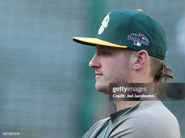 Josh Donaldson of the Oakland Athletics looks on during batting practice during Game One of the American League Division Series against the Detroit...