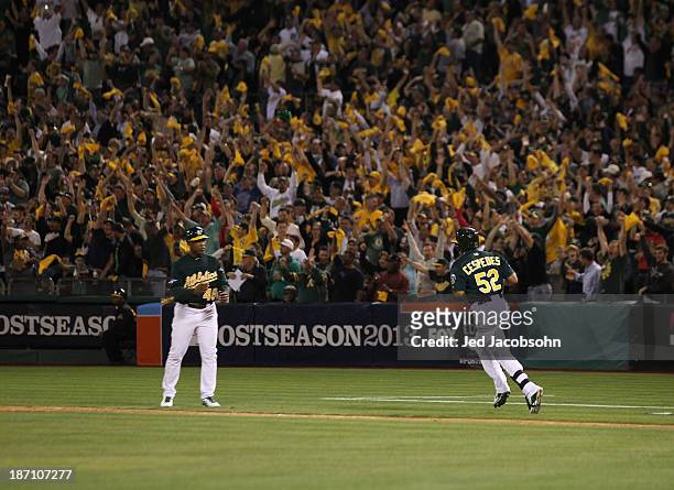 Yoenis Cespedes of the Oakland Athletics hits a two run home run during Game One of the American League Division Series against the Detroit Tigers on...