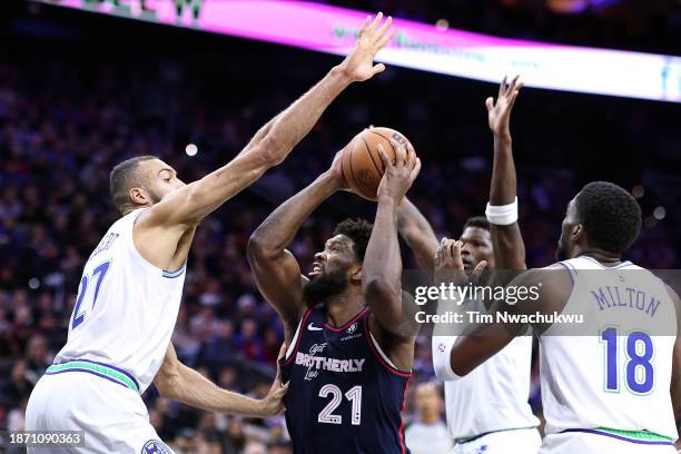 Joel Embiid of the Philadelphia 76ers is guarded by Rudy Gobert, Anthony Edwards amd Shake Milton of the Minnesota Timberwolves during the second...