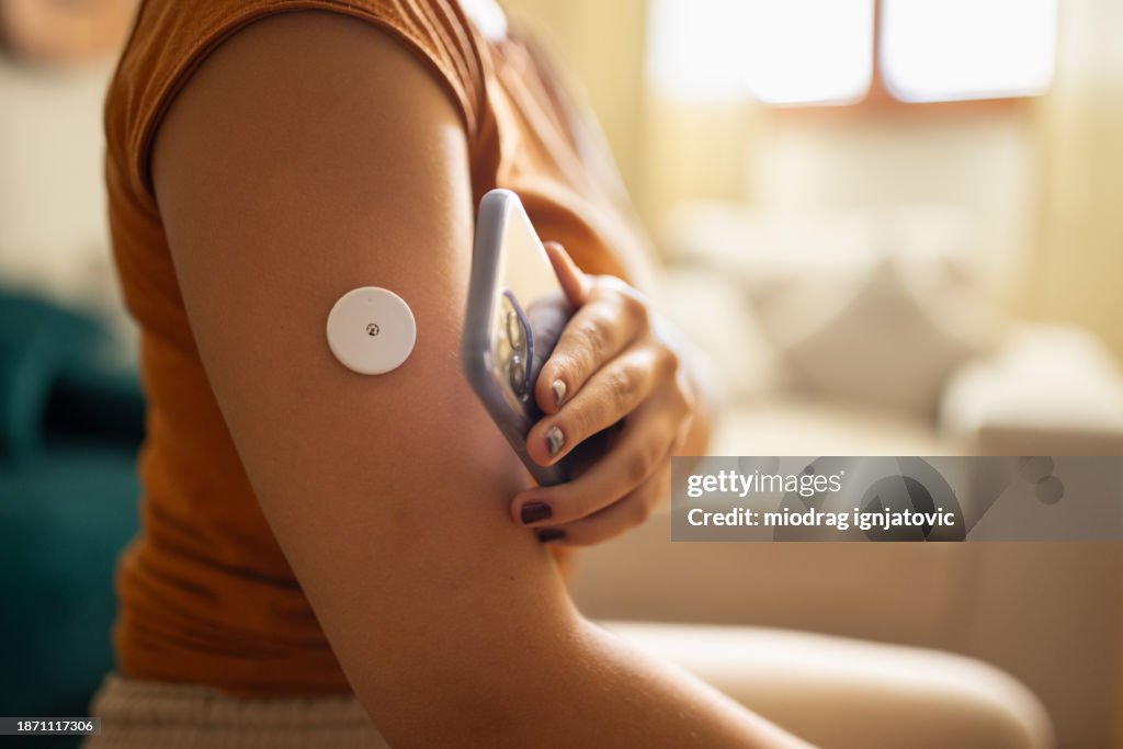 Woman monitoring glucose level