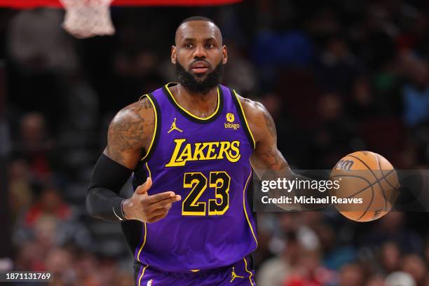 LeBron James of the Los Angeles Lakers dribbles up the court against the Chicago Bulls during the first half at the United Center on December 20,...