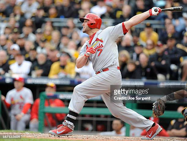 Matt Holliday of the St. Louis Cardinals hits a two run home run during Game Four of the National League Division Series against the Pittsburgh...
