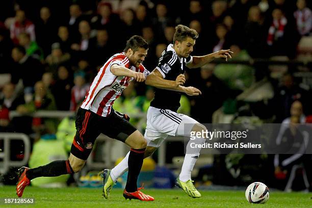 Ondrej Celustka of Sunderland vies with Jay Rodriguez of Southampton during the Capital One Cup fourth Round match between Sunderland and Southampton...
