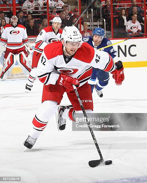 Brett Sutter of the Carolina Hurricanes moves the puck during their NHL game against the Tampa Bay Lightning at PNC Arena on November1, 2013 in...