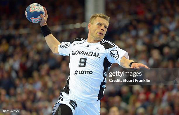 Gudjon Valur Sigurdsson of Kiel throws a goal during the Bundesliga handball match between THW Kiel and Rhein Neckar Loewen at the Sparkasse arena on...